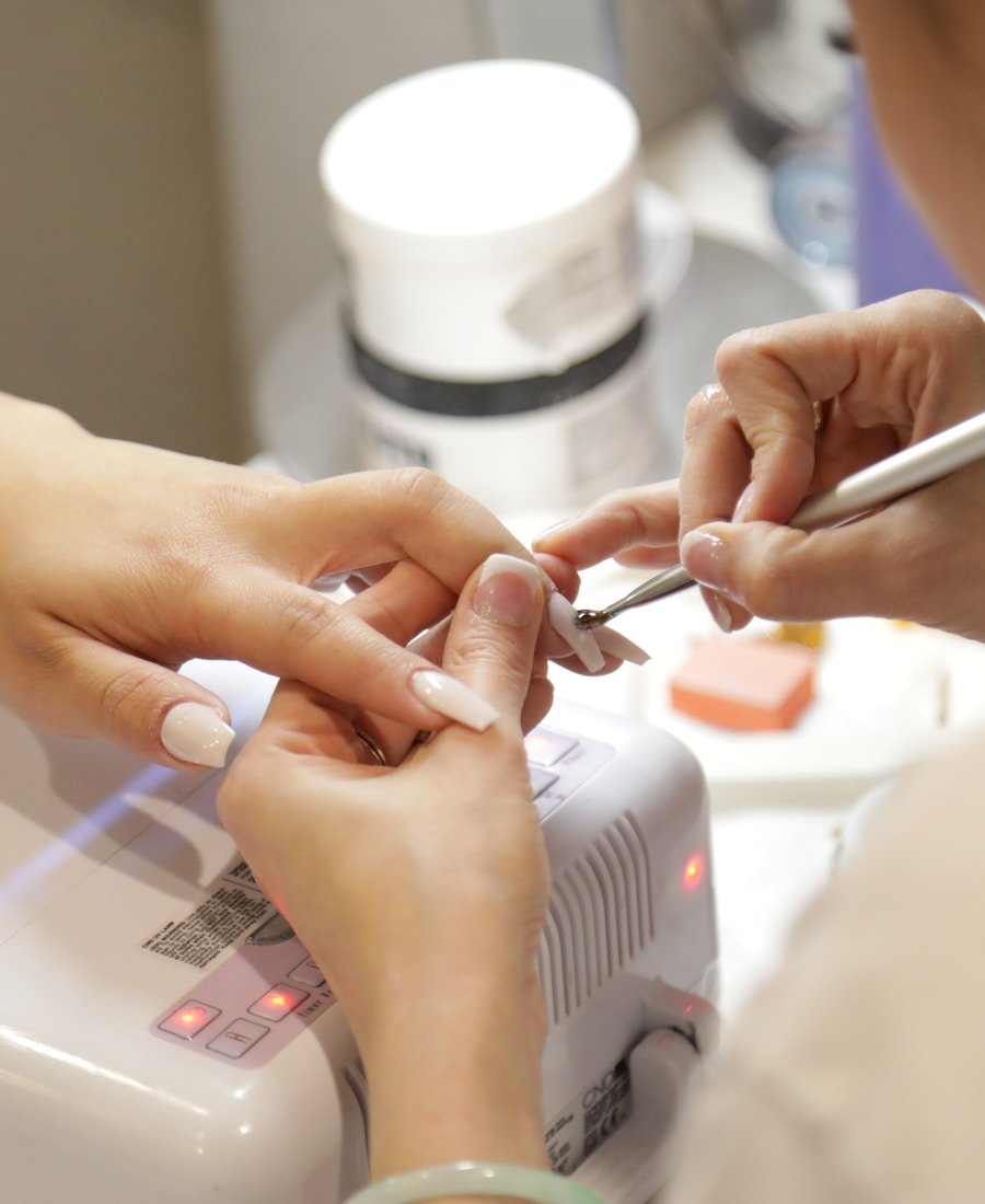 Nail tech working on client